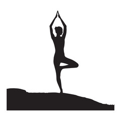 Fototapeta premium Silhouette of a woman practicing yoga tree pose near a bare tree