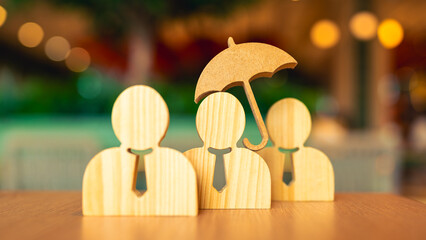 Insurance salesman holding umbrella symbol with businessman employee model concept of group insurance provided by company to employees