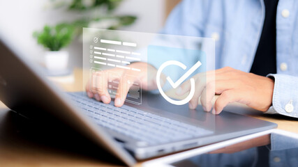 Businessman validating digital documents using futuristic interface with checkmark icons, quality assurance system, compliance review, and document verification.