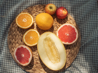 Assorted Fresh Fruits on Woven Platter for Summer Picnic