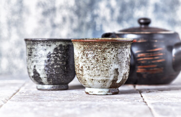 Tea culture. Traditional, handcrafted ceramic on stone background.	