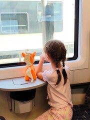 Little girl travels by train