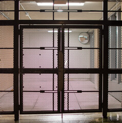Industrial Metal Gate with Dimly Lit Interior