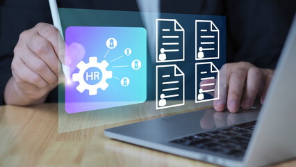 HR management online employee assessment, and professional insights, recruitment.Businessman using a tablet to manage digital profiles and performance reviews.
