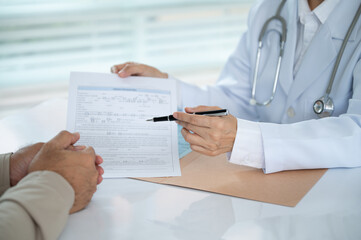 Doctor consult patient discussing diagnosis medical and make an appointment in examination room at hospital.