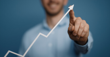 businessman drawing graph