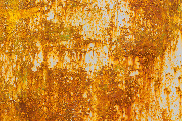 Extensively rusted metal with peeling white paint
