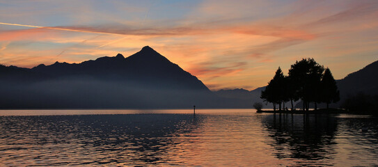 Lake Thunersee and Niesen at sunset. View from Neuhaus, Switzerland.
