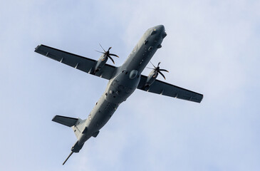 Heavy military transport aircraft in flight. Jet transport army weapons. 