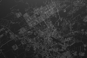 Street map of Islamabad (Pakistan) on black paper with light coming from top