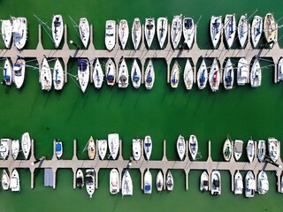 a marina with sailing ships – drone aerial photography