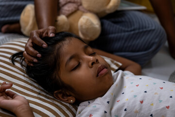 Child sleeping peacefully with a gentle massage