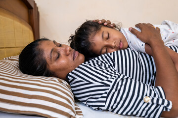 Sweet moment of mother and daughter cuddling peacefully