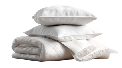 Stack of white bedding including pillows blanket and bed sheet isolated on a white background representing comfort and luxury
