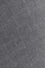 Close-up view of textured fabric revealing detailed weave pattern in a dark shade suitable for design and textile analysis