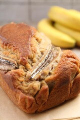 Homemade banana bread and fruits on table, closeup