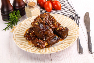 Prepared tasty beef ribs with sauce