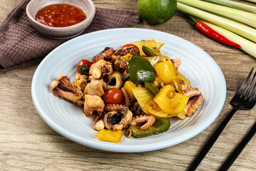 Roasted octopus with vegetables and oil