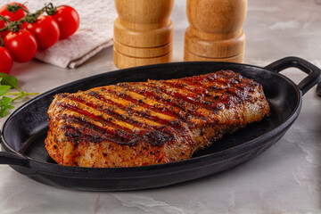 Grilled pork steak with bone