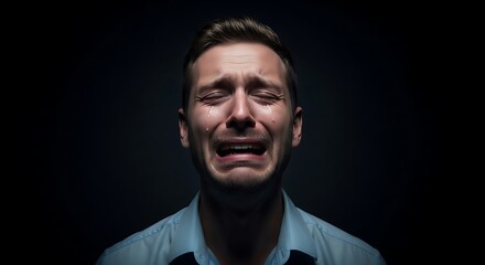 Obraz premium Man Crying with Tears Studio Portrait on Dark Background
