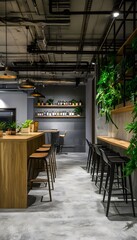Industrial style cafe interior with exposed ductwork and plants.