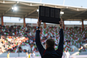 Technical referee showsboard with non added time during the football match.