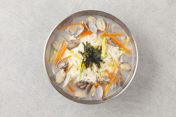   A dish made by kneading wheat flour, rolling it out thinly with a mallet, then cutting it into...
