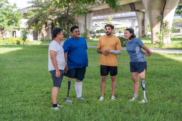 group of healthy multiracial friends including person with prosthetic legs talking and supporting together,gathering,exercise in garden