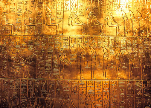 Egyptian hieroglyphics on golden plate from king Tutankhamun tomb.