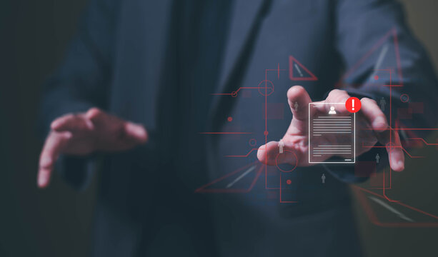 Close up shot of people point to access to personal data and document with warning sign as concept of data breach or attack from hacker or spyware. Data security concept.