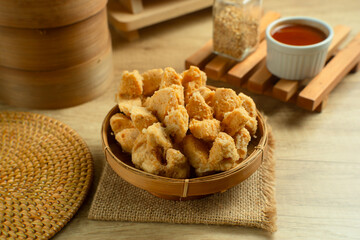 Indonesian Snack Food. Bakso Goreng or Deep Fried Meatball. Made from Chicken, Meat, or Shrimp with Flour. Served with Spicy Sauce. Perfect for recipes, articles or any cooking content.