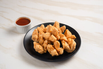 Indonesian Snack Food. Bakso Goreng or Deep Fried Meatball. Made from Chicken, Meat, or Shrimp with Flour. Served with Spicy Sauce. Perfect for recipes, articles or any cooking content.
