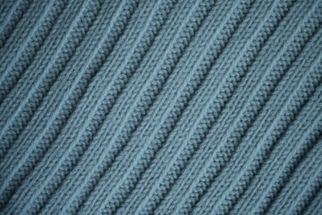 blue texture of knitted fabric, macro texture of blue woolen fabric, geometric knitted pattern of crocheted elastic as a background