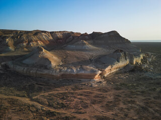 Aerial: intricate formations of Aktumsik Cape's eroded sandstone mounds