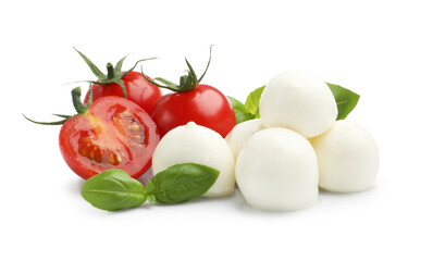 Tasty mozzarella cheese balls, tomatoes and basil isolated on white