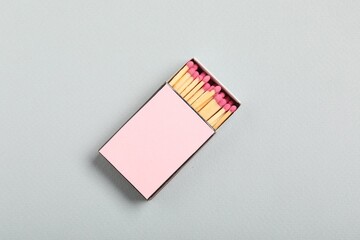 Matches in box on grey background, top view. Mockup for design