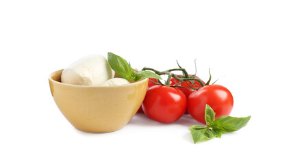 Tasty mozzarella cheese balls, tomatoes and basil on white background