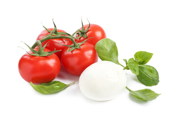 Tasty mozzarella cheese ball, tomatoes and basil on white background