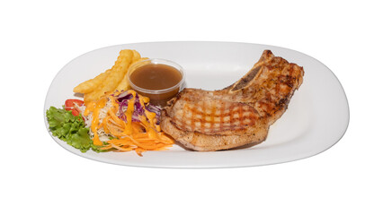 Grilled Pork Chop with Salad, Fries, and Gravy Sauce on White Plate