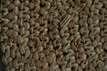 macro texture of summer brown paper hat as background, close up texture of panama hat, paper for...