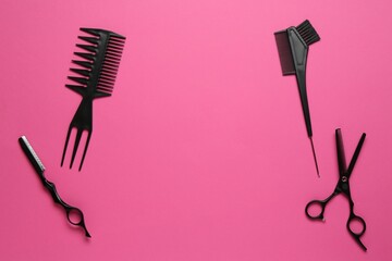 Different hairdresser's tools on pink background, flat lay. Space for text