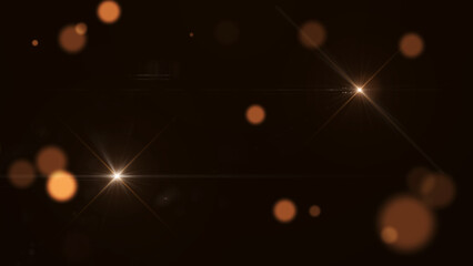 Glowing orange and white lens flares with soft bokeh effects on a dark background