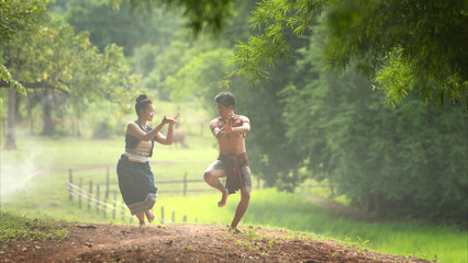 A farmer and a rice worship ritual with a group of traditional dancers