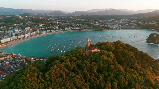 Sunset view over the statue of Christ in San Sebastian town, Basque, Spain 
