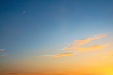 A stunning sunset with vibrant colors of orange, yellow, and blue in the sky.