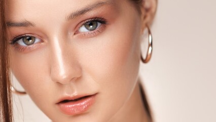 Elegant Female Close-Up With Glossy Lips And Shiny Gold Accessories