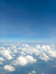 Beautiful and fluffy white cumulus clouds in the blue sky
