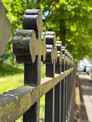 old iron fence by the graveyard in the city