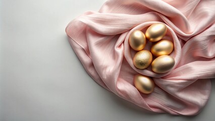 Elegant gold eggs nestled in blush pink silk fabric