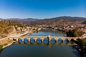 Expansive Aerial Vista of Mehmed Paša Sokolović Bridge, Drina River Reflection, and Višegrad Town